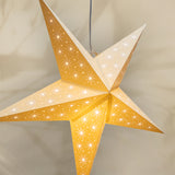 Star-shaped lantern with a yellow and white design on a beige background