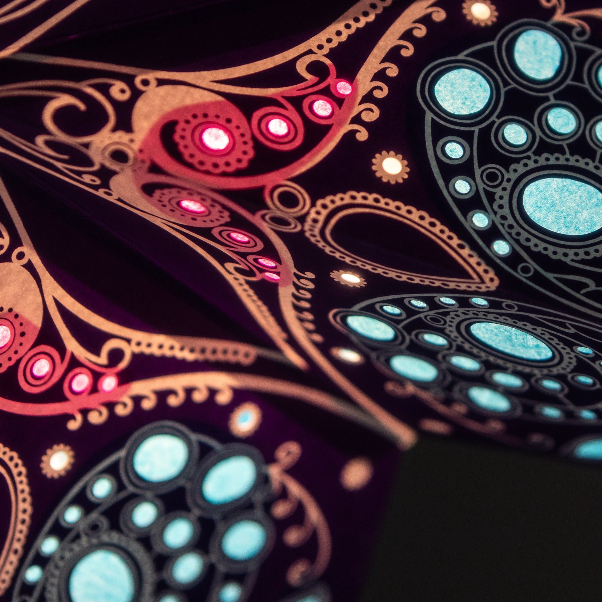 close up of purple and multi tissue paper star lantern