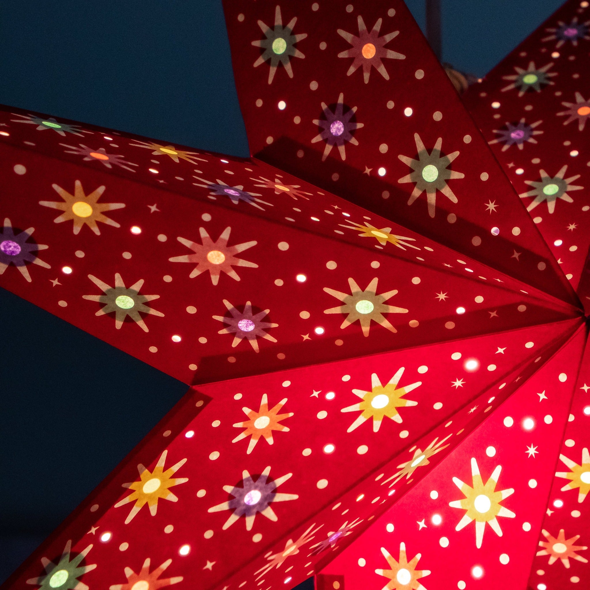 close up of red paper star lantern