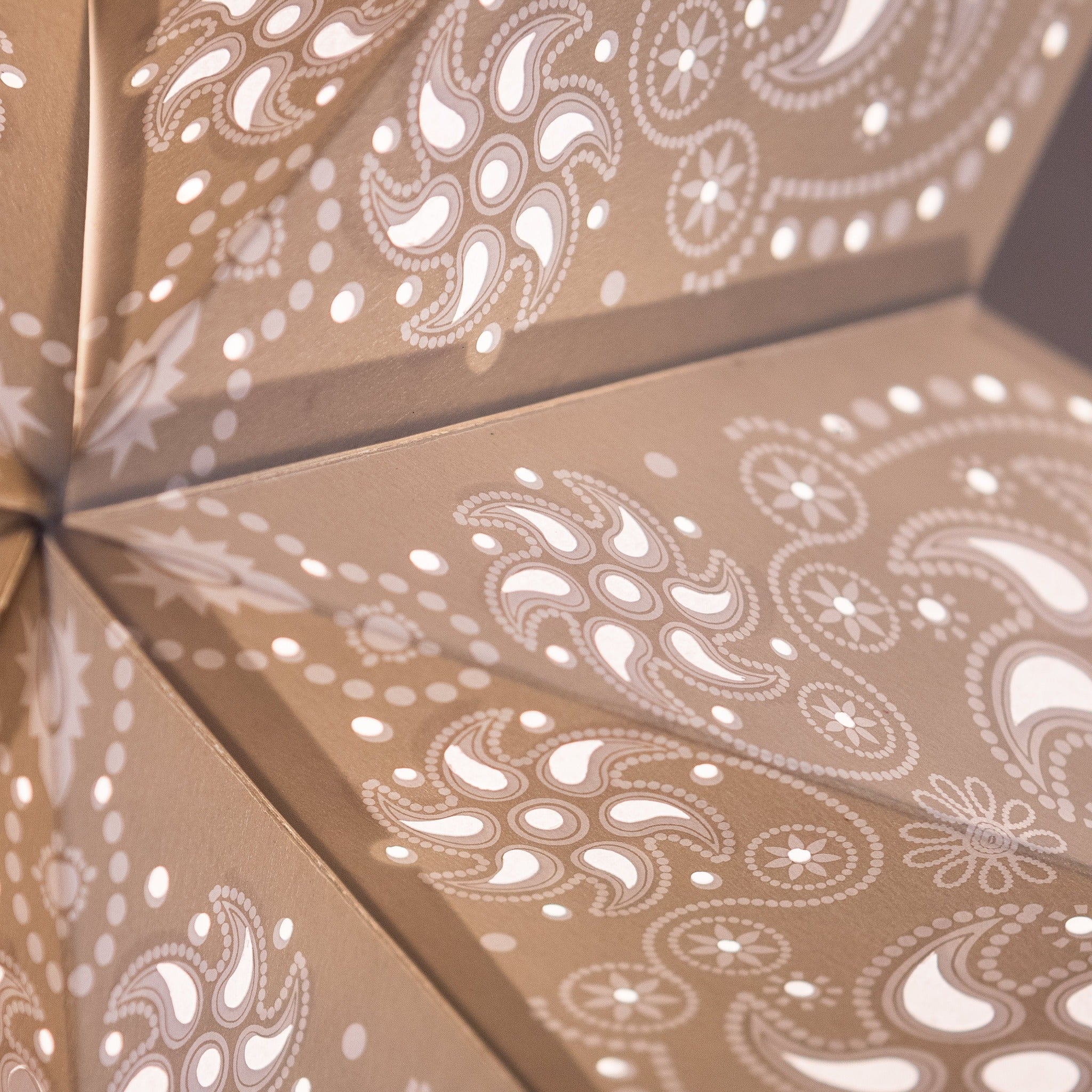 close up of grey patterned star lantern