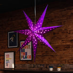 purple paper star lantern illuminated