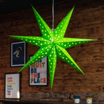 green paper star lantern illuminated