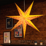 yellow paper star lantern illuminated
