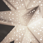 close up of white paper star lantern