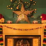 black patterned star lantern with warm glow
