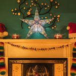 blue firework patterned star lantern illuminated