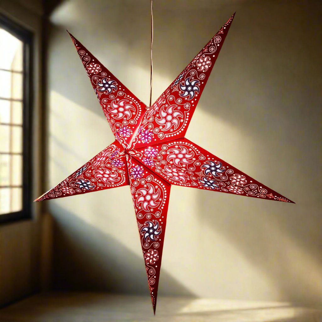 large red firework patterned star lantern illuminated