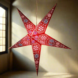 large red firework patterned star lantern illuminated