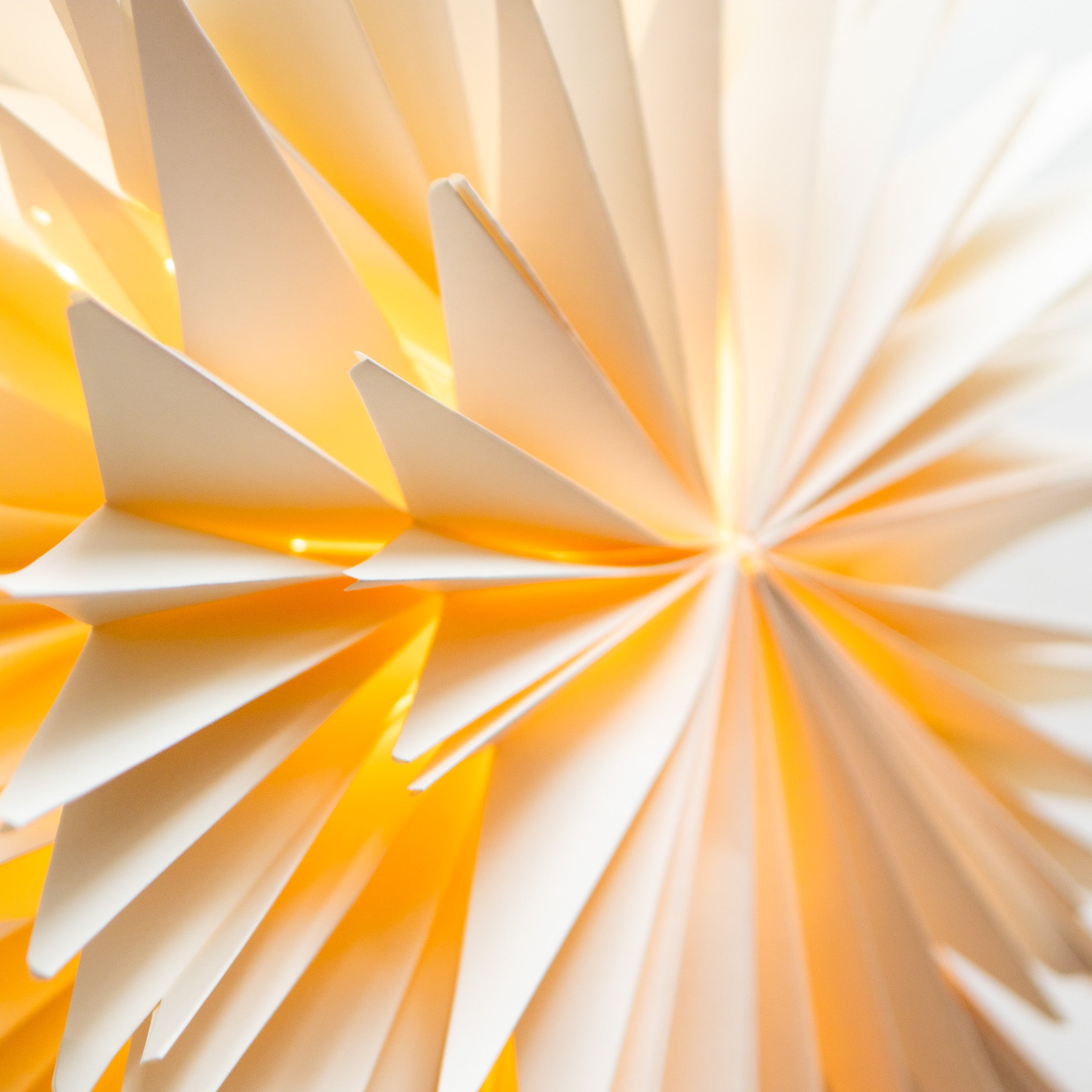 Close-up of a paper star decoration with a soft focus background