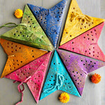 Set of 8 Colourful mini paper stars in red, yellow, blues and purples, perfect for holiday ornaments or year-round home decor accents.