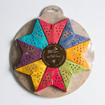 Set of 8 Colourful mini paper stars in red, yellow, blues and purples, perfect for holiday ornaments or year-round home decor accents.