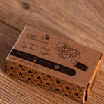 Cardboard box with starlight text on a wooden surface