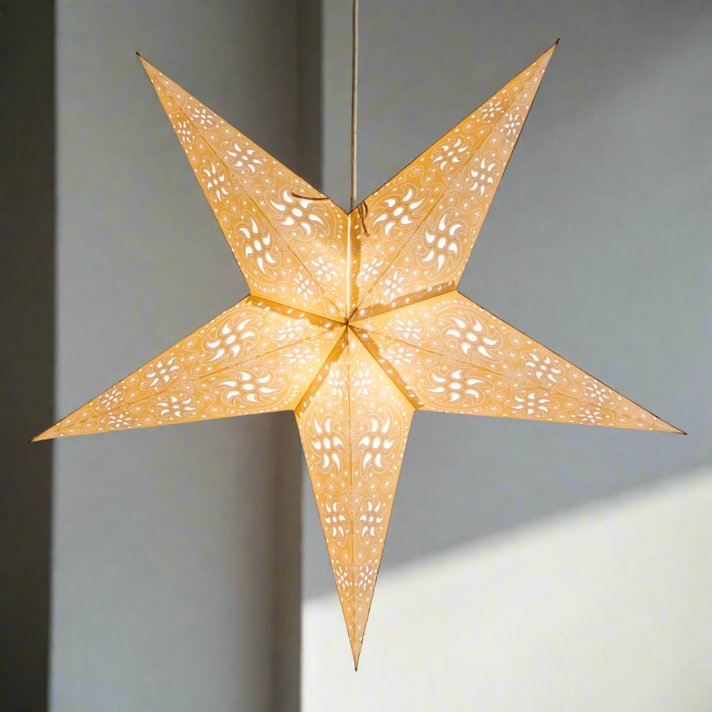 Decorative star-shaped lantern with cut-out patterns on a white background