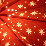 close up of large orange star lantern