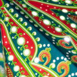 close up of green star with red pattern