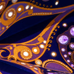 close up of purple and gold star lantern