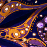 close up of purple and gold star lantern