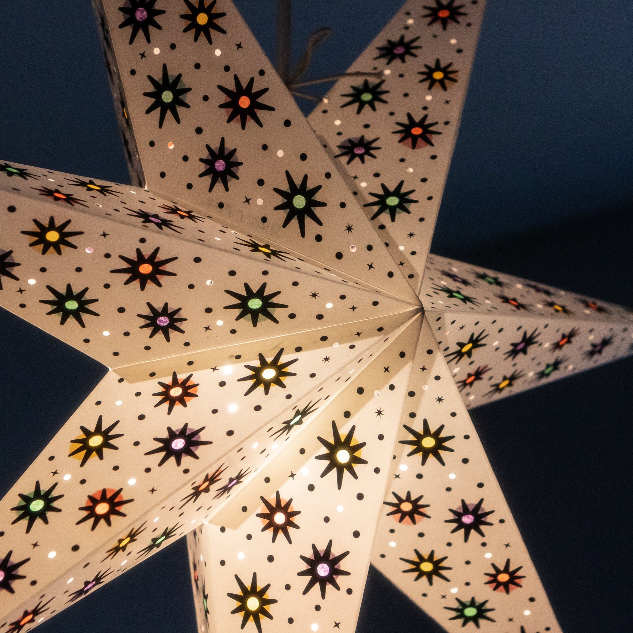 close up of white paper star lantern