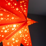 close up of Halloween light - pumpkin orange paper star lantern