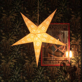 large grey firework patterned star lantern illuminated
