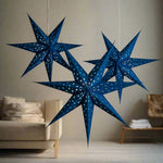 3 blue paper star lanterns illuminated