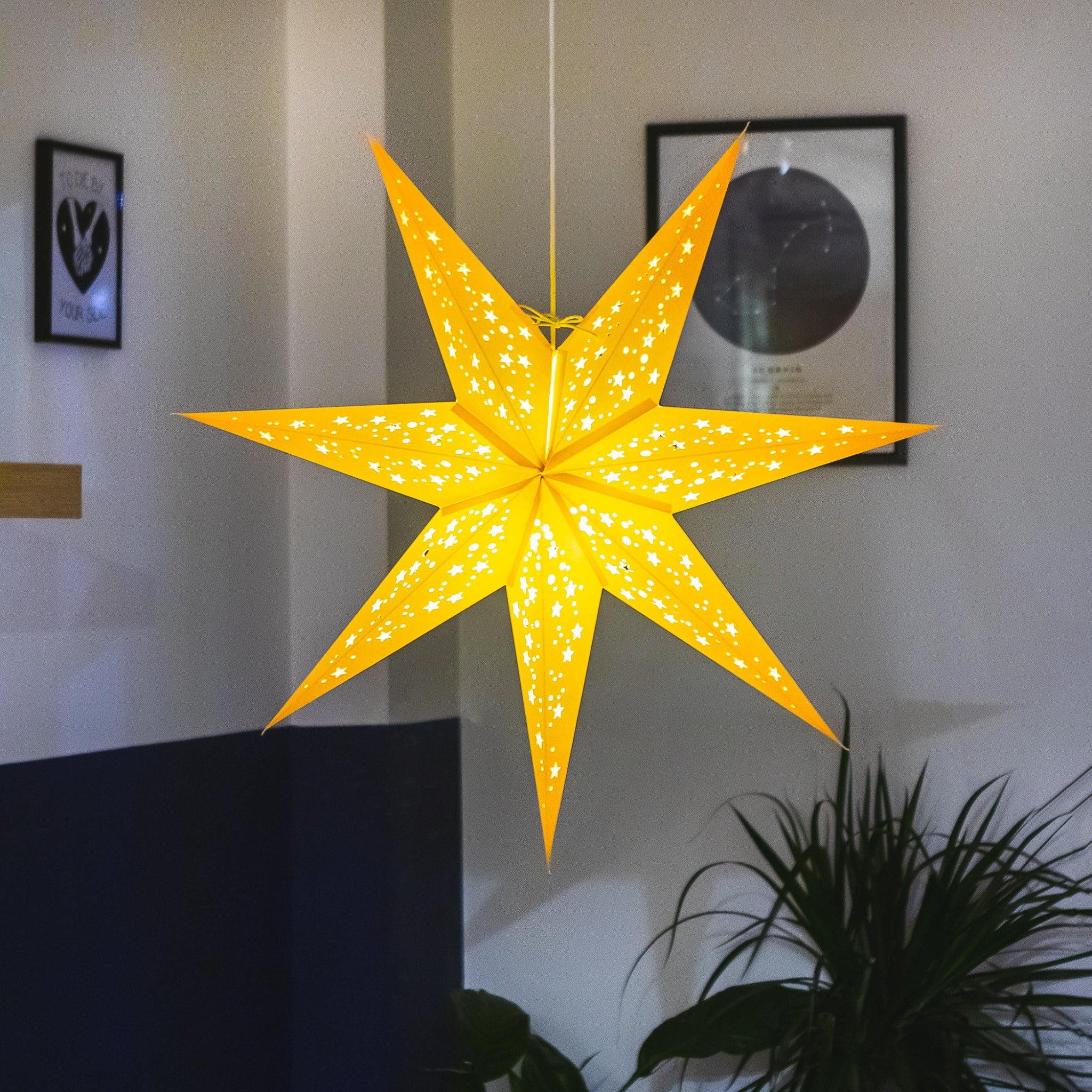 yellow paper star lantern illuminated