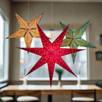 illuminated yellow, red and green paper stars