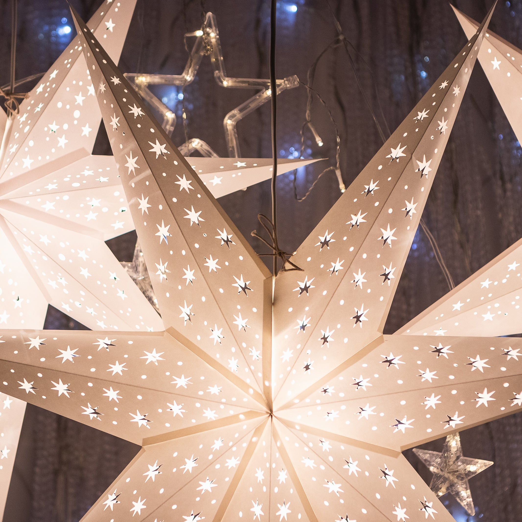 three white paper star lanterns