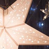 three white paper star lanterns